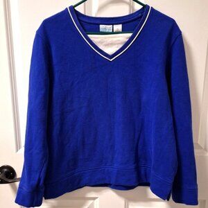 A Kim Rogers long sleeve blue sweatshirt in a ladies' large petite.